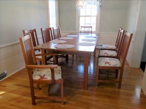 Set of 8 Italian made dining chairs | Upholstered in an indoor-outdoor shell pattern fabric | Upholstered by Cape Cod Upholstery Shop | Located in South Dennis, MA