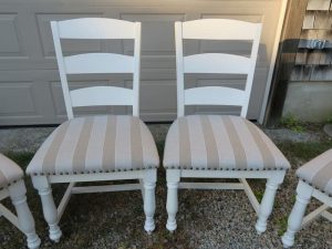 Set of four kitchen chairs | Upholstered in a Sunbrella stripe | Upholstered by Cape Cod Upholstery Shop | Located in South Dennis, MA