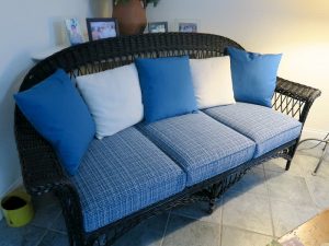 Wicker sofa with removable seat cushions and back pillows | Upholstered in a Stout Fabrics and Greenhouse Fabrics stripe and solid | Upholstered by Cape Cod Upholstery Shop | Located in South Dennis, MA 02660
