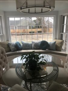 Dining room with a one piece Window Seat Cushion to fit bay window | Upholstered in a Revolution Base Fabric Upholstered by Cape Cod Upholstery Shop | Located in South Dennis, MA 02660