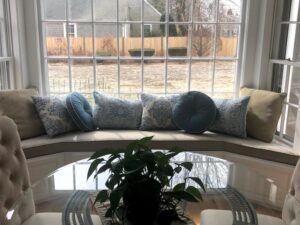 Dining room with a one piece Window Seat Cushion to fit bay window | Upholstered in a Revolution Base Fabric Upholstered by Cape Cod Upholstery Shop | Located in South Dennis, MA 02660