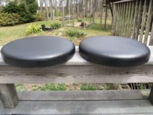 Round Bar Stool Seats with Boxing | Upholstered in black vinyl | Upholstered by Cape Cod Upholstery Shop | Located in South Dennis, MA 02660