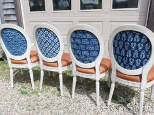 Chair backs upholstered with Batik Fabric imported from India | French arm and side chairs, upholstered in their original genuine leather, were part of This Old House Concord Cottage Season 25 | Batik fabric backs Upholstered by Cape Cod Upholstery Shop | Located in South Dennis, MA 02660