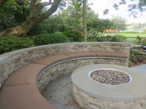 Five semi-circular fire pit cushions with a salt water view | Upholstered on the top and sides with a Sunbrella Canvas Chestnut and Phifertex mesh fabric on the bottom | Ez-Dri outdoor foam | Upholstered by Cape Cod Upholstery Shop | Located in South Dennis, MA 02660