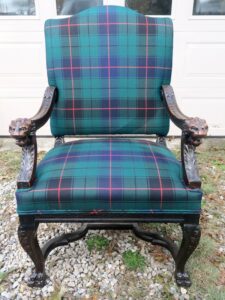 Antique lions head throne chair, portrait view. Upholstered in a 100% wool Tartan fabric imported from Scotland | Wood restoration by Wesley Woodworking | Upholstered by Cape Cod Upholstery Shop | Located in South Dennis, MA 02660