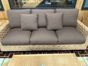 Wicker sofa seat and back cushions | Cushion covers made using Sunbrella Canvas Chestnut color | Upholstered by Cape Cod Upholstery Shop | Located in South Dennis, MA 02660