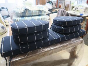 Seat and bench cushions with ties | Upholstered in a Revolution Fabrics indoor-outdoor nautical stripe fabric | Upholstered by Cape Cod Upholstery Shop | Located in South Dennis, MA 02660