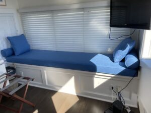 Large 96"x24" cushion with 6" round bolsters and throw pillows for Provincetown loft bedroom | Upholstered in a blue JF Fabric | Upholstered by Cape Cod Upholstery Shop | Located in South Dennis, MA 02660