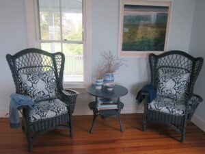 Antique Wicker Wing Chair painted blue | Upholstered with a Perennials high performance fabric | Upholstered by Cape Cod Upholstery Shop located in South Dennis, MA 02660