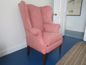 Antique wing chair with a view from the side of the chair | Upholstered in a Perennials Performance fabric | Upholstered by Cape Cod Upholstery Shop located in South Dennis, MA 02660