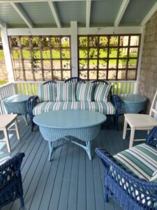 Three Piece Wicker Set, painted in blue on a covered porch | Cushion covers fabricated in a Perennials stripe indoor-outdoor fabric | Cushion inserts are rated for outdoor use | Cushions fabricated by Cape Cod Upholstery Shop | Located in South Dennis, MA 02660
