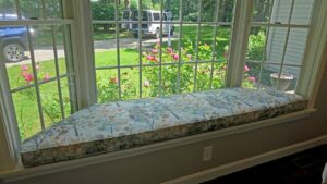 96"x24" trapezoid shaped window seat cushion | Cushion fabricating with a Greenhouse Fabrics 100% cotton floral print fabric | Cushions fabricated by Cape Cod Upholstery Shop | Located in South Dennis, MA 02660