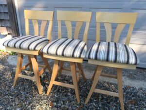 Matching swivel bar stools with a maple frame. Upholstered in a Greenhouse Fabric S2313 Noir stripe fabric | Upholstered by Cape Cod Upholstery Shop | Located in South Dennis, MA 02660