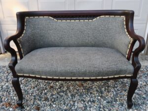 Antique Mahogany loveseat Circa 1020-1930. Upholstered with decorative nails in a style in memory of the customers grandmother. Upholstered by Cape Cod Upholstery Shop | Located in South Dennis, MA 02660