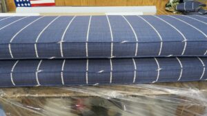 Two boxed style cushions with a small stripe. Welting cord is cut on the bias. Cushions fabricated by Cape Cod Upholstery Shop | Located in South Dennis, MA 02660