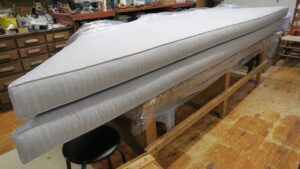 10'x32" bench cushions ready for delivery. Cushions to be installed in a finished basement recreation room. Cushions fabricated using Sunbrella Ticking-Fog. Cushions fabricated by Cape Cod Upholstery Shop | Located in South Dennis, MA 02660