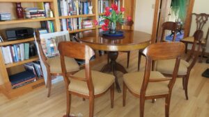 Pecan Wood dining room chairs with an upholstered seat. Upholstered in a Revolutions Fabrics South Paw color mustard fabric. Upholstered by Cape Cod Upholstery Shop | Located in South Dennis, MA 02660