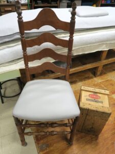 Ladder Back Chair Seat ready for delivery, one of six. Seat upholstered in a Greenhouse Fabrics faux leather vinyl material. Upholstered by Cape Cod Upholstery Shop | Located in South Dennis, MA 02660