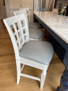 Set of 3 barstool seats upholstered in a silvery gray faux leather vinyl material from Greenhouse Fabrics. All new 2" CertiPur-US high density foam and dacron padding. Upholstered by Cape Cod Upholstery Shop | Located in South Dennis, MA 02660