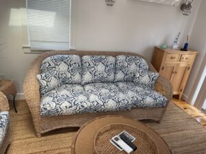 Wicker Set Photo #5. Wicker sofa and love seat with loose seat and back cushions. Cushion covers fabricated with a screen printed blue & white floral print. Cushions fabricated by Cape Cod Upholstery Shop | Located in South Dennis, MA 02660