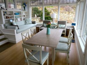 Built-in bench cushions and loose dining room chair cushions with ties. Bench seat cushion is 100" long with three loose back cushions, two round bolsters and accent throw pillows. Cushions fabricated by Cape Cod Upholstery Shop | Located in South Dennis, MA 02660