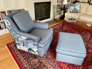 Matching chair and ottoman from the side view. Upholstered in coordinating fabrics using JF Fabrics Freestyle, Sunbrella Spectrum and a toile print. Upholstered by Cape Cod Upholstery Shop | Located in South Dennis, MA 02660