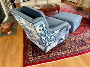 Matching chair and ottoman from the back view. Upholstered in coordinating fabrics using JF Fabrics Freestyle, Sunbrella Spectrum and a toile print. Upholstered by Cape Cod Upholstery Shop | Located in South Dennis, MA 02660