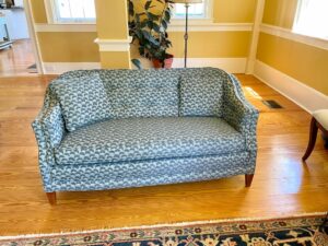 Buttoned Attached Pillow Back Love Seat with a single cushion. Upholstered in a United Fabrics performance fabric. Upholstered by Cape Cod Upholstery Shop | Located in South Dennis, MA 02660