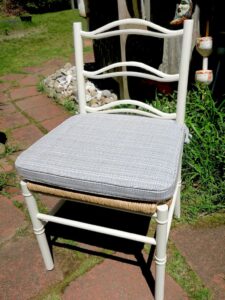 One of a set of 8 rush seat ladder back dining chair cushions. Cushions fabricated using a customer supplied Delany & Long Houseboat Navy/Bluebird fabric. Cushions fabricated by Cape Cod Upholstery Shop | Located in South Dennis, MA 02660