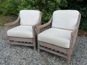 Matching Rattan chairs with loose seat and back cushions. New seat webbing and seat foam and dacron insert. Upholstered in a natural nubby fabric. Upholstered by Cape Cod Upholstery Shop | Located in South Dennis, MA 02660