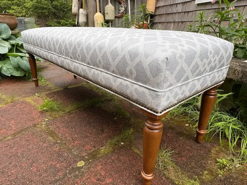 Side view of a 60" Ethan Allen upholstered bench with decorative nail trim. Upholstered by Joe Gramm of Cape Cod Upholstery Shop - South Dennis, MA 02660