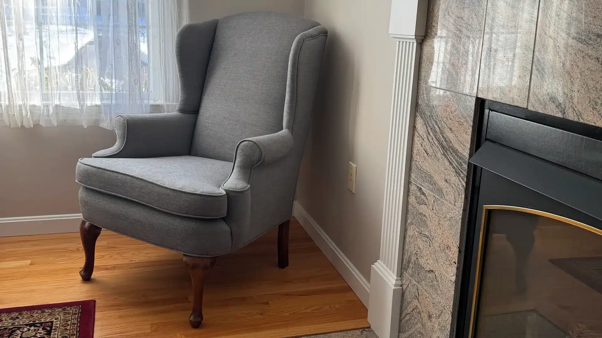 Queen Anne Wing Chair side view. Upholstered by Joe Gramm of Cape Cod Upholstery Shop - South Dennis, MA 02660