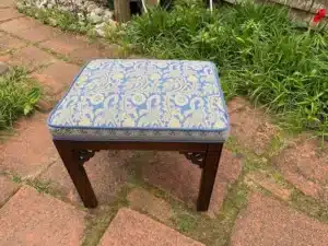 Chippendale foot stool upholstered in an Egyptian style fabric. Upholstered by Joe Gramm of Cape Cod Upholstery Shop - South Dennis, MA 02660